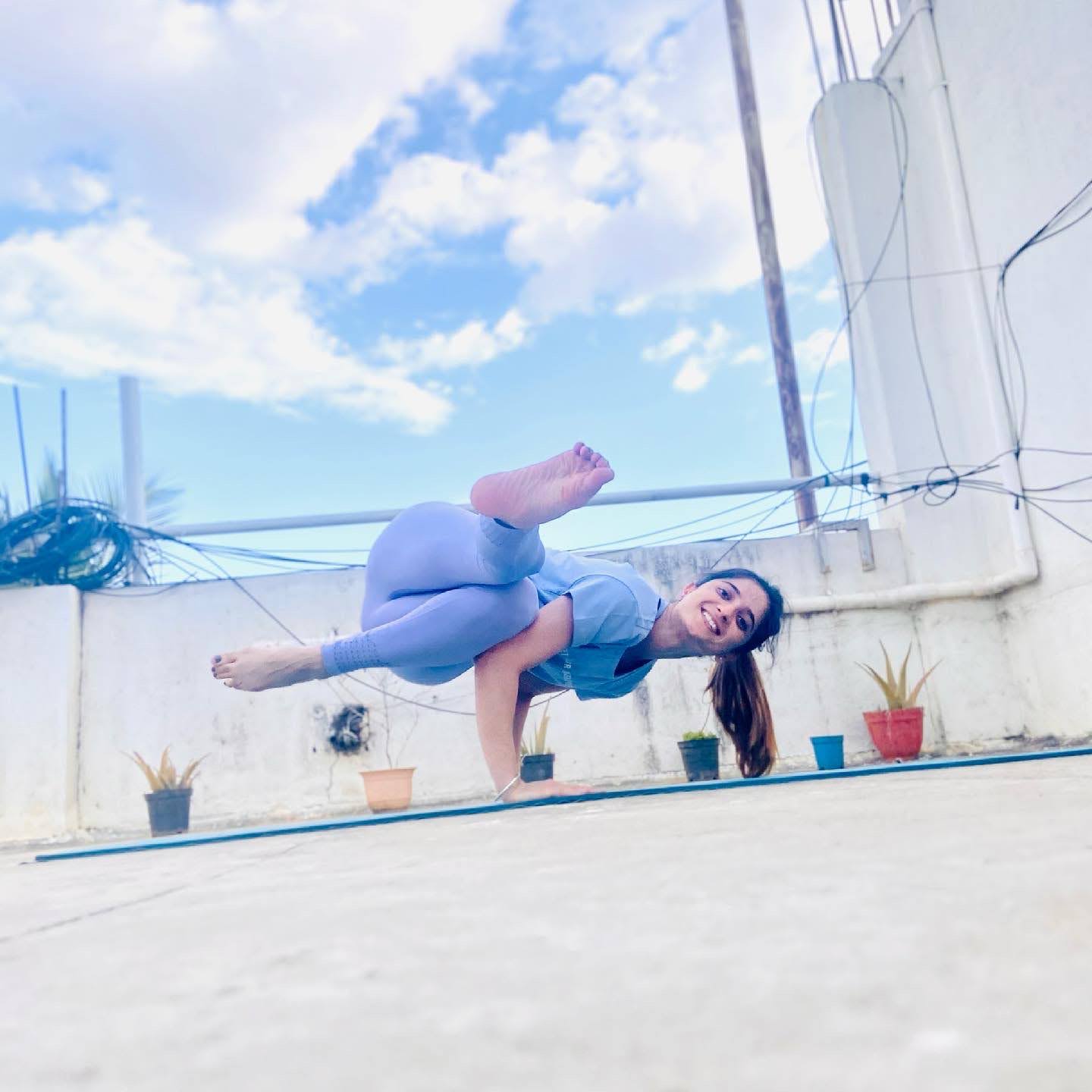 Rishu in a side plank yoga balance — pranayama for blood pressure